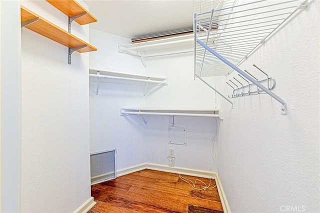 walk in closet featuring wood-type flooring