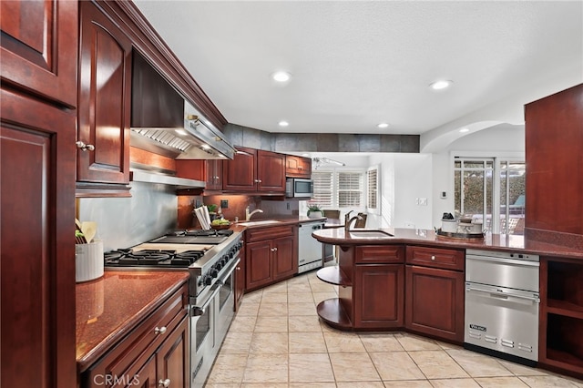 kitchen with light tile patterned floors, sink, and appliances with stainless steel finishes