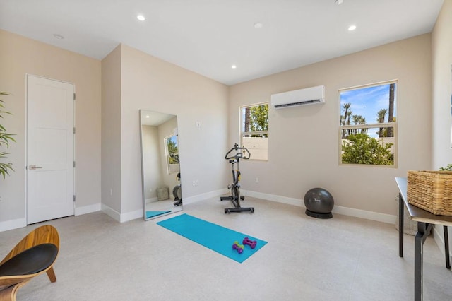 exercise area featuring a wall mounted air conditioner