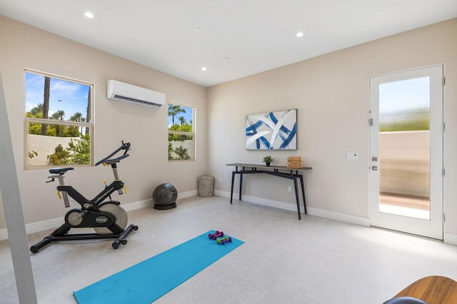 exercise area featuring a wall mounted AC