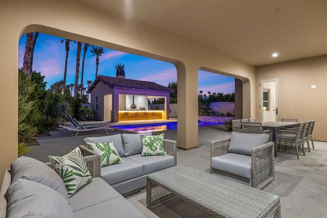 patio terrace at dusk with an outdoor hangout area