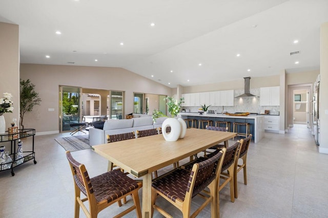 dining room with vaulted ceiling