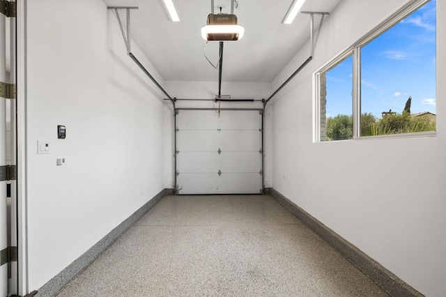 garage featuring a garage door opener