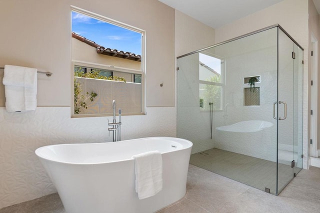 bathroom with plus walk in shower and a wealth of natural light