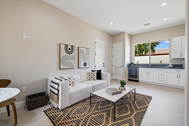 tiled living room with sink and wine cooler