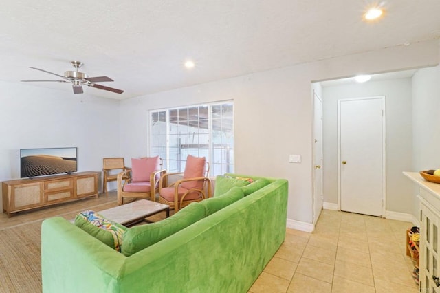 tiled living room featuring ceiling fan