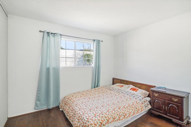 bedroom featuring dark wood-type flooring