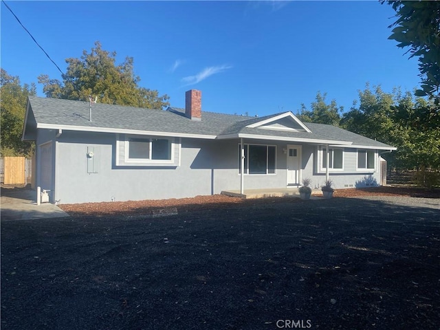 1954 Durham Dayton, Durham, CA 95938 - ranch-style house featuring a chimney, stucco siding, and covered porch
