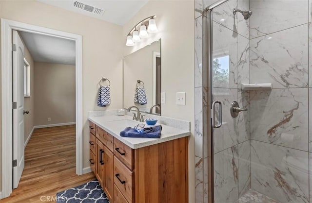 1954 Durham Dayton, Durham, CA 95938 - bathroom featuring wood finished floors, a marble finish shower, and vanity
