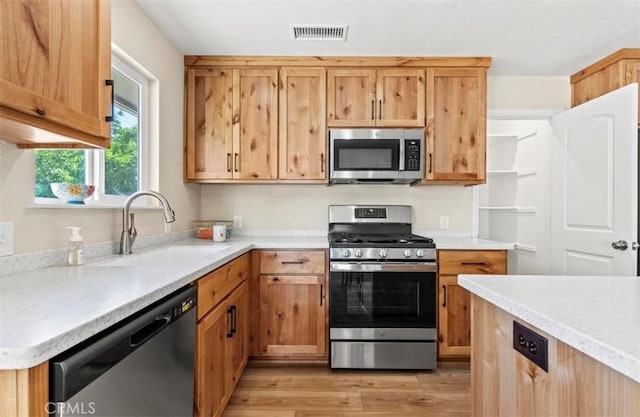 1954 Durham Dayton, Durham, CA 95938 - kitchen featuring stainless steel appliances, light countertops, and light wood-style floors