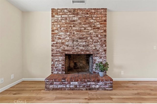 1954 Durham Dayton, Durham, CA 95938 - unfurnished living room featuring wood finished floors and a brick fireplace