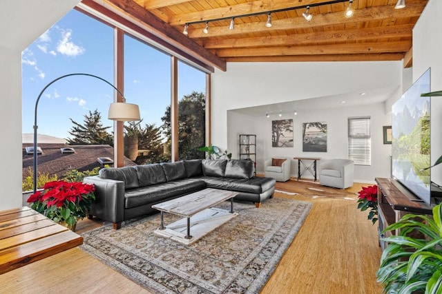 living room with wood-type flooring, wood ceiling, beamed ceiling, and track lighting