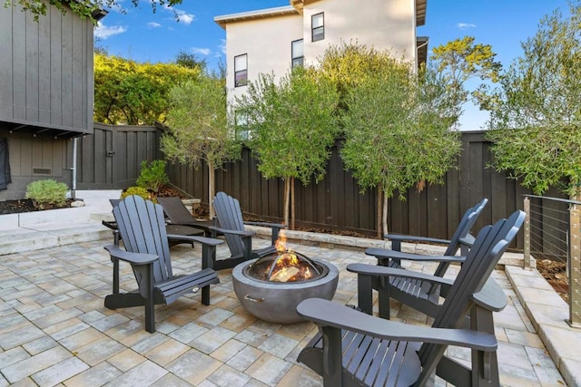 view of patio / terrace with an outdoor fire pit