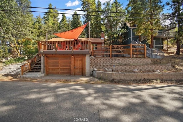 exterior space with a deck and a garage