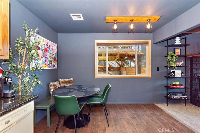 dining room with hardwood / wood-style floors