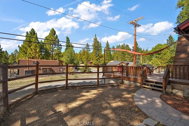 view of yard featuring a wooden deck