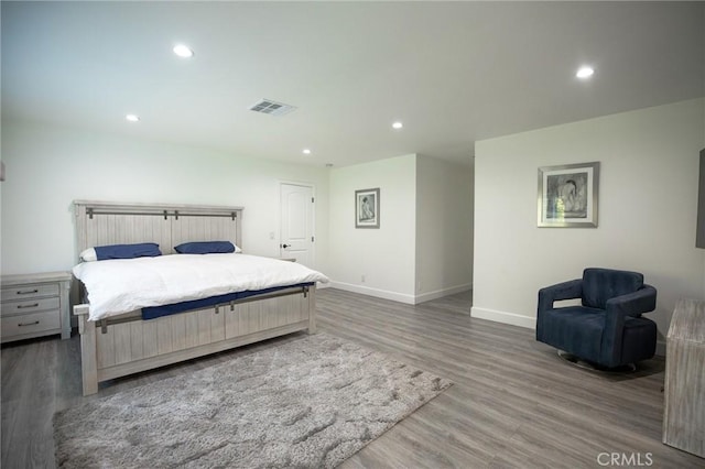 bedroom with dark wood-type flooring