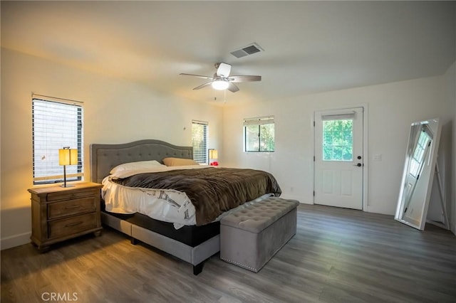 bedroom featuring ceiling fan and dark hardwood / wood-style floors