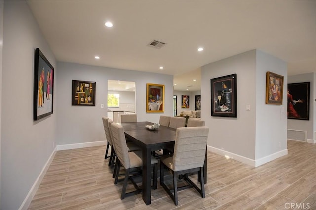 dining area featuring light wood-type flooring