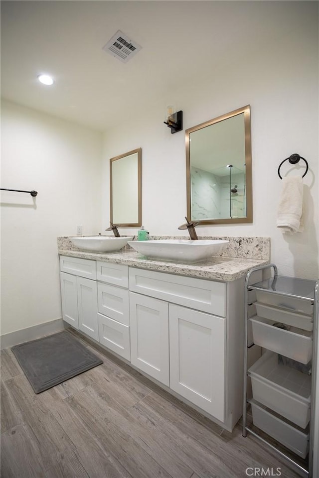 bathroom featuring vanity and hardwood / wood-style flooring