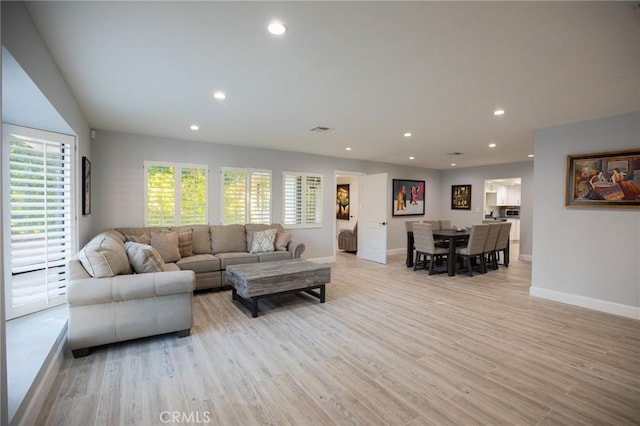 living room featuring light hardwood / wood-style floors and plenty of natural light