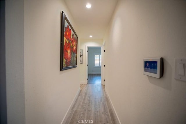 corridor featuring light wood-type flooring