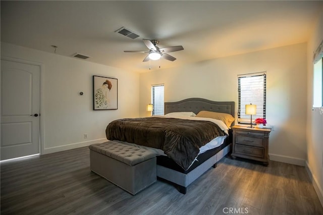 bedroom featuring dark hardwood / wood-style floors and ceiling fan