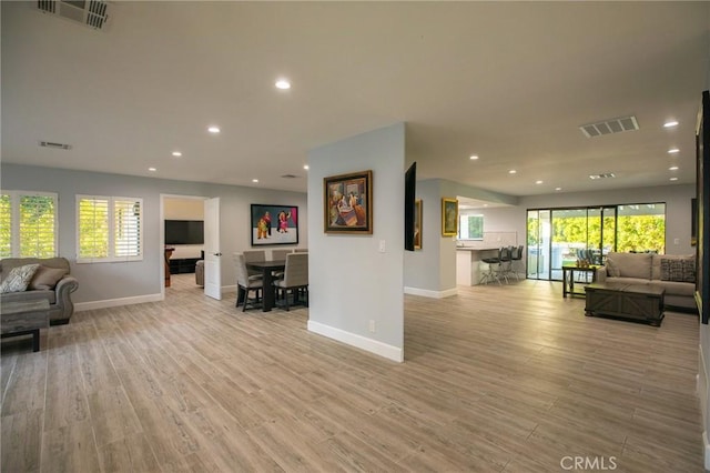 living room with light hardwood / wood-style floors