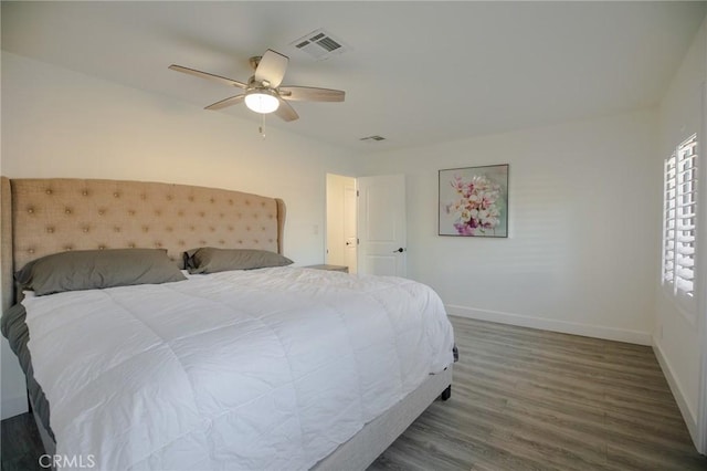 bedroom with hardwood / wood-style flooring and ceiling fan