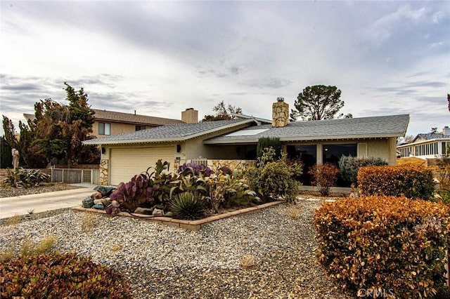 single story home featuring a garage