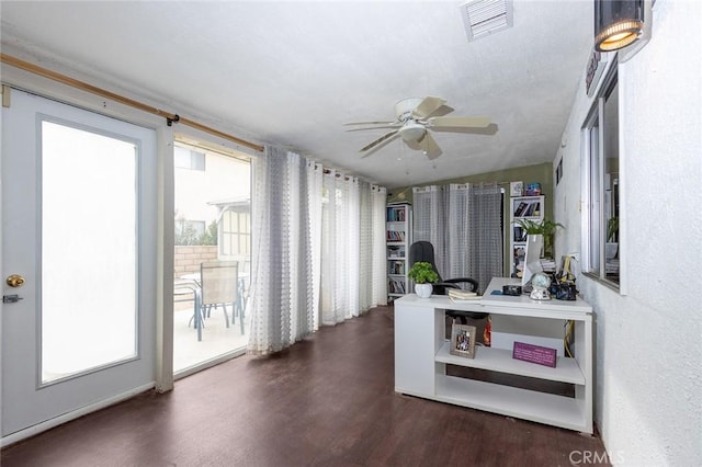 interior space featuring dark hardwood / wood-style floors, ceiling fan, and lofted ceiling