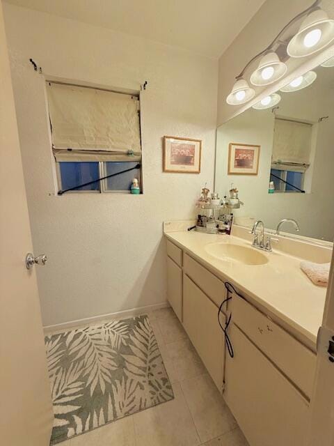 bathroom featuring tile patterned floors and vanity