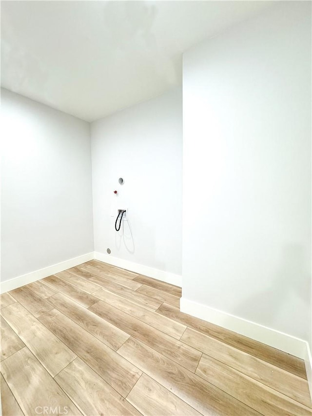 washroom with washer hookup and hardwood / wood-style flooring