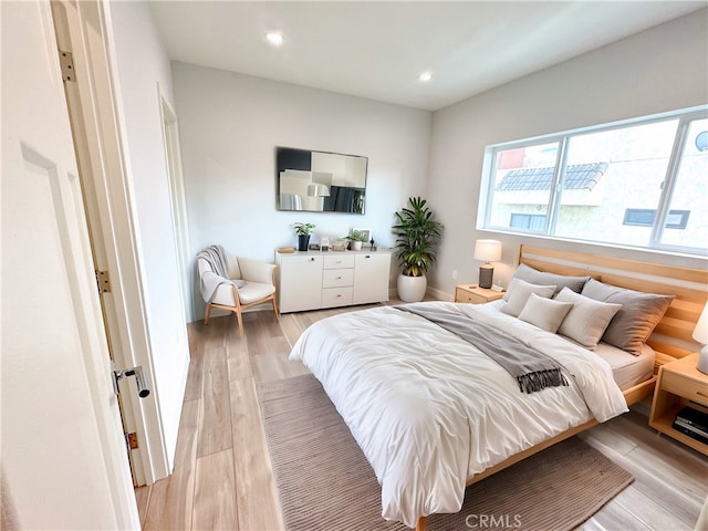 bedroom with light wood-type flooring