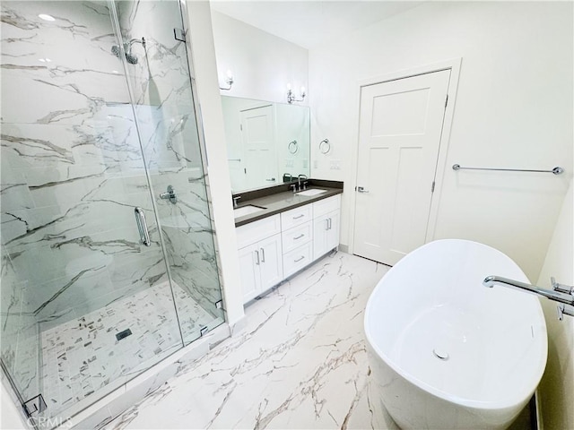 bathroom with separate shower and tub and vanity