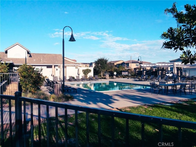 view of swimming pool with a patio area