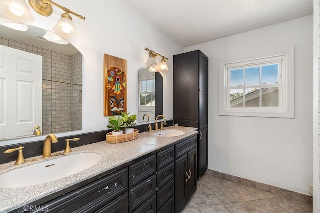 bathroom featuring tile patterned flooring and vanity