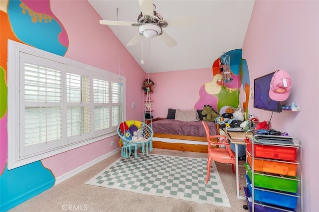 carpeted bedroom with ceiling fan and high vaulted ceiling