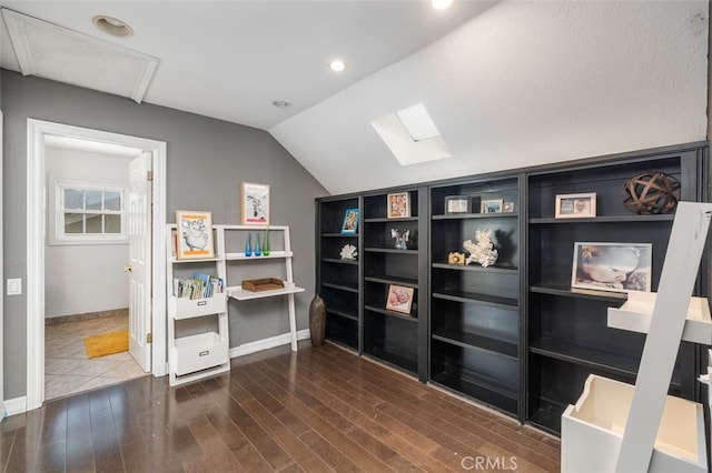 home office with dark hardwood / wood-style floors and lofted ceiling