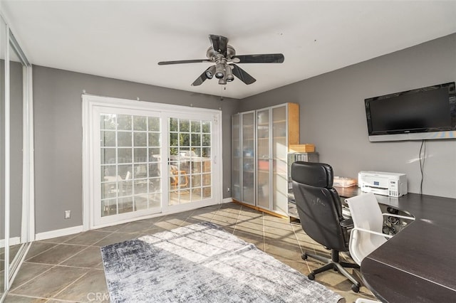 tiled office space featuring ceiling fan