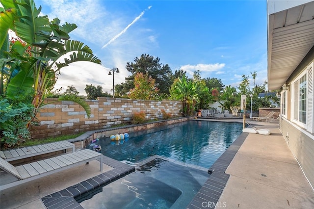 view of swimming pool with a patio