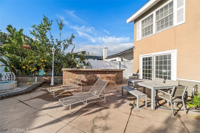 view of patio / terrace featuring an outdoor bar