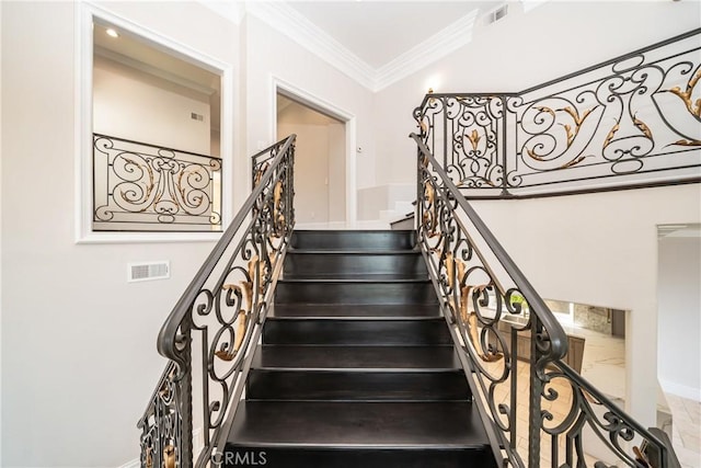 staircase with ornamental molding