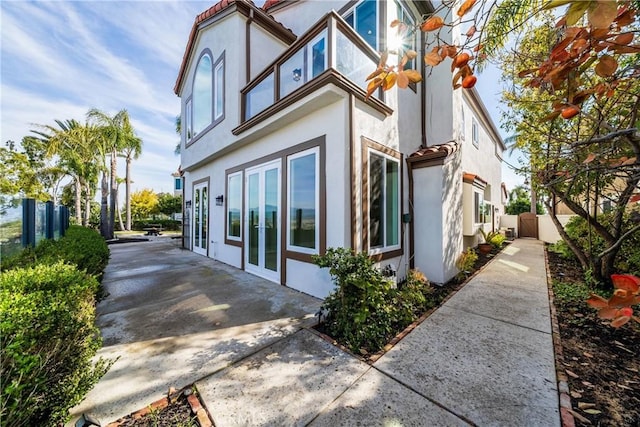 view of property exterior with french doors