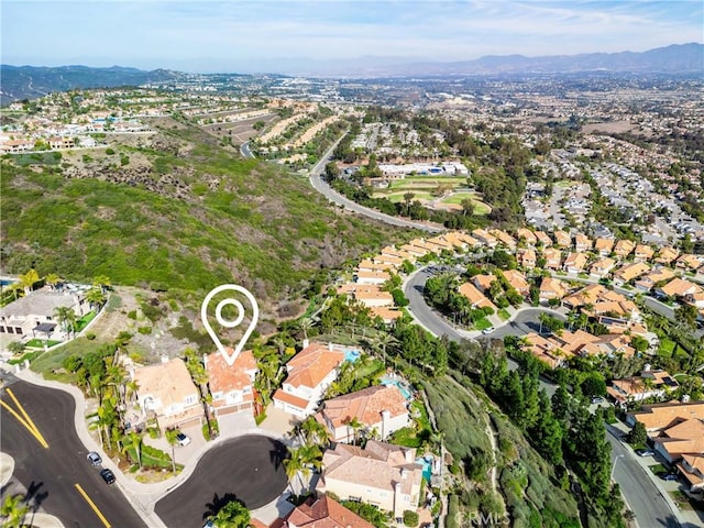 birds eye view of property with a mountain view