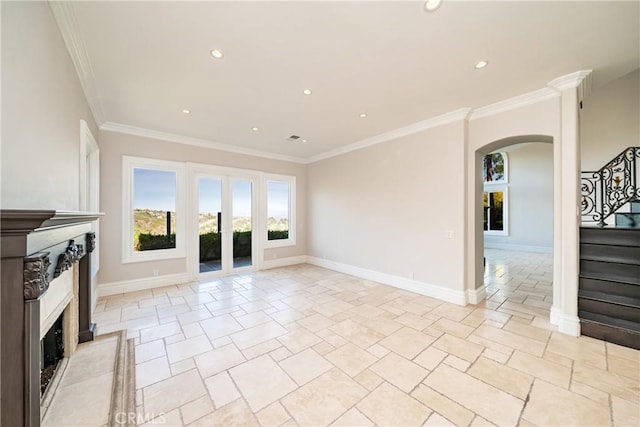 unfurnished living room with ornamental molding