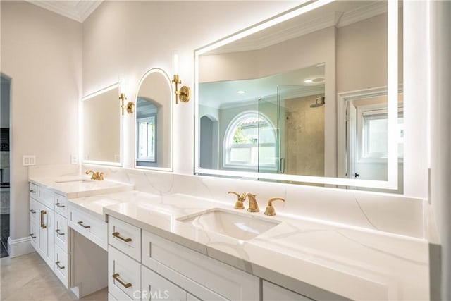 bathroom featuring tile patterned flooring, vanity, walk in shower, and crown molding