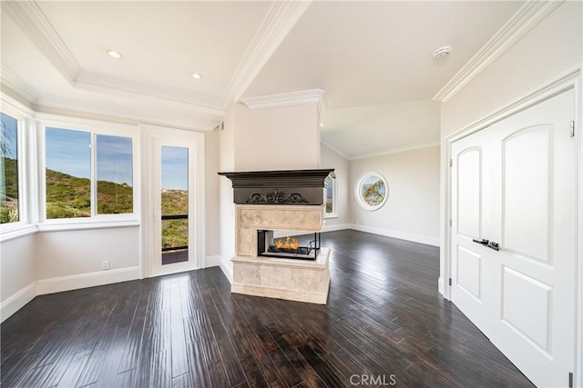 unfurnished living room featuring a multi sided fireplace, dark hardwood / wood-style flooring, and crown molding