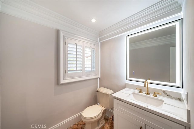 bathroom featuring vanity, toilet, and crown molding