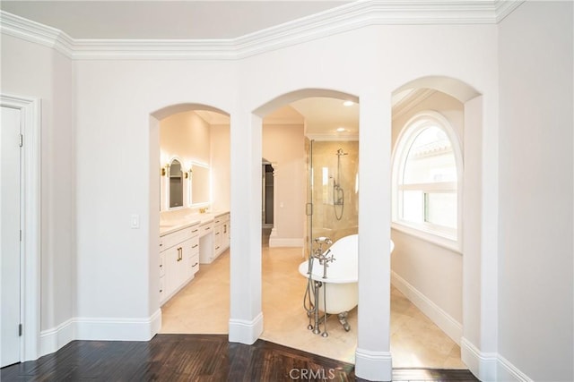 hallway featuring hardwood / wood-style flooring and ornamental molding